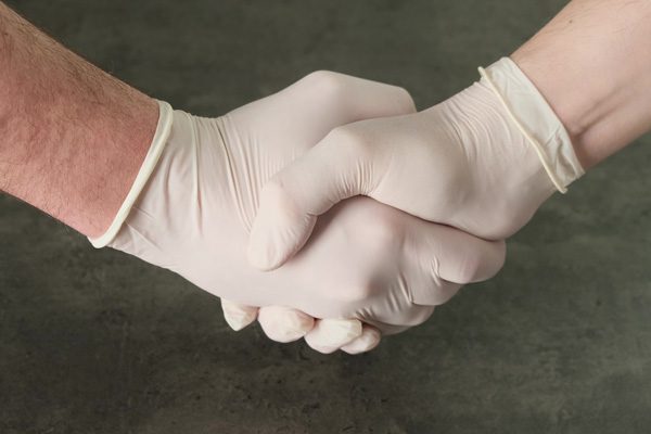 healthcare workers shaking hands