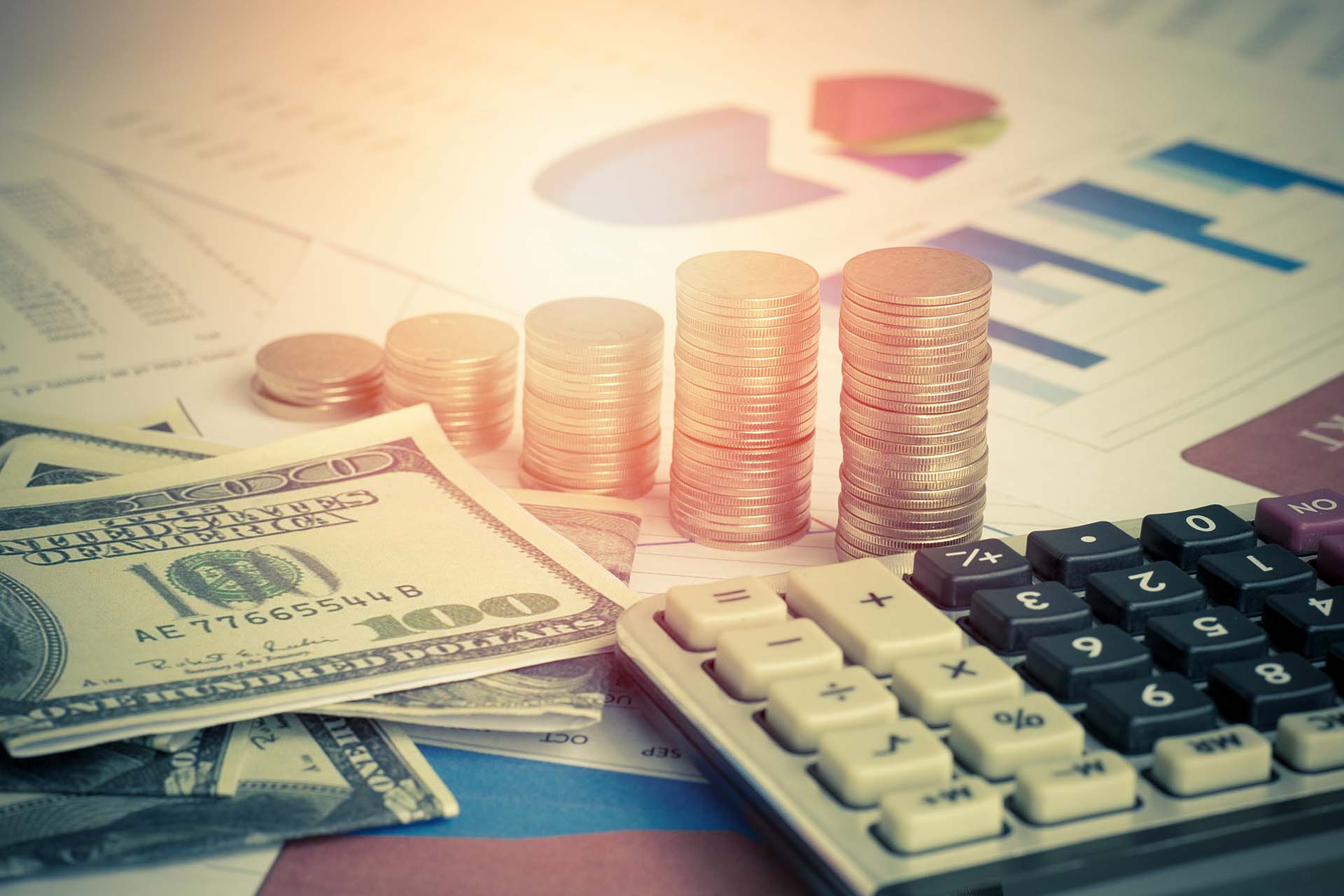 calculator and money coins on graph paper, concept in growth, sa calculator and money coins on graph paper, concept in growth, sa